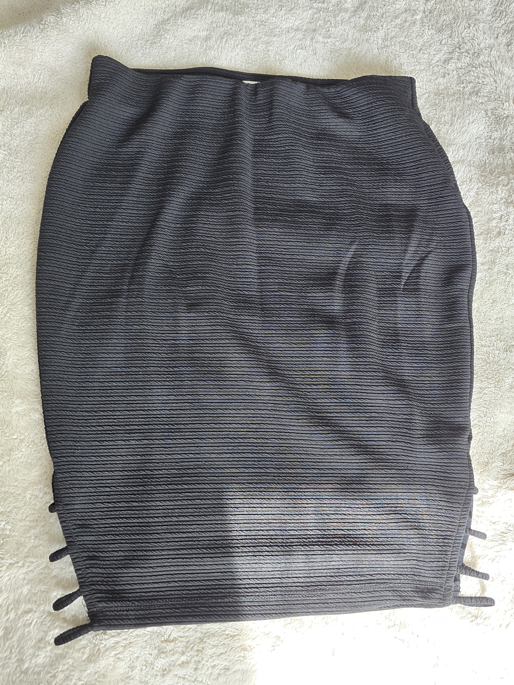 Sleek Black Ribbed Skirt with Side Strap Detail